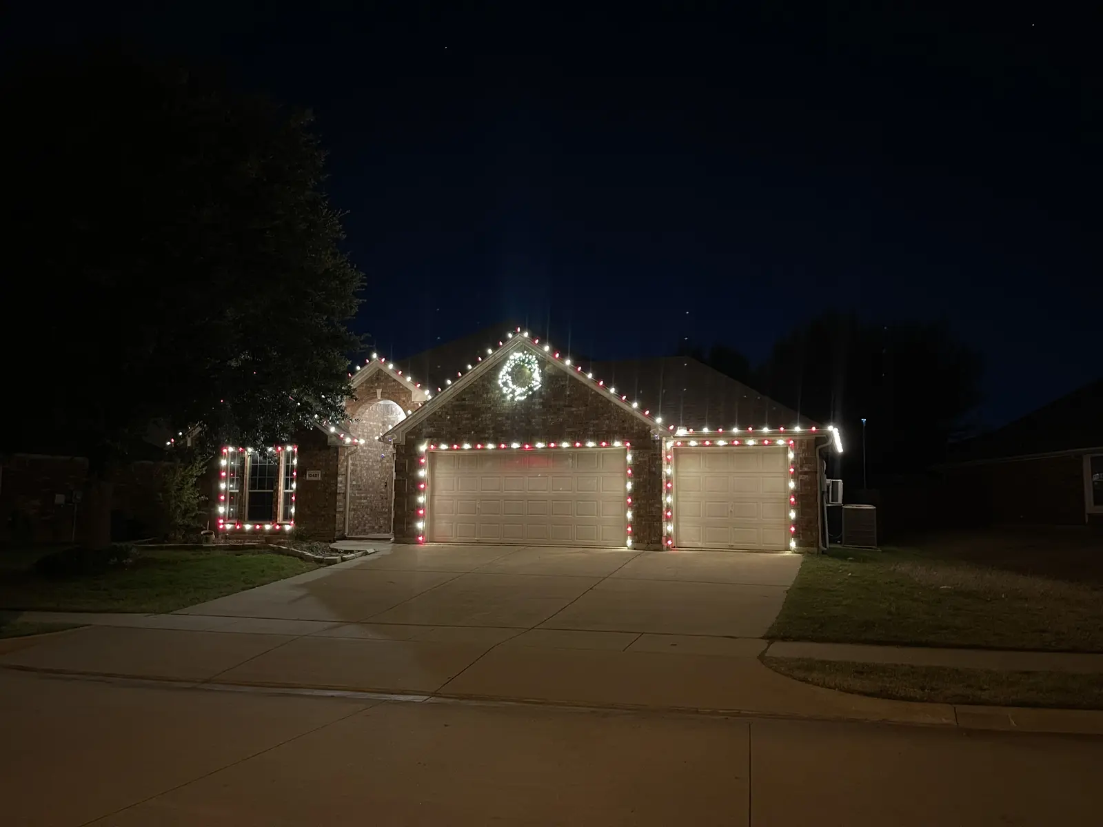 10401 Vintage Drive at night with holiday lights along the roofline